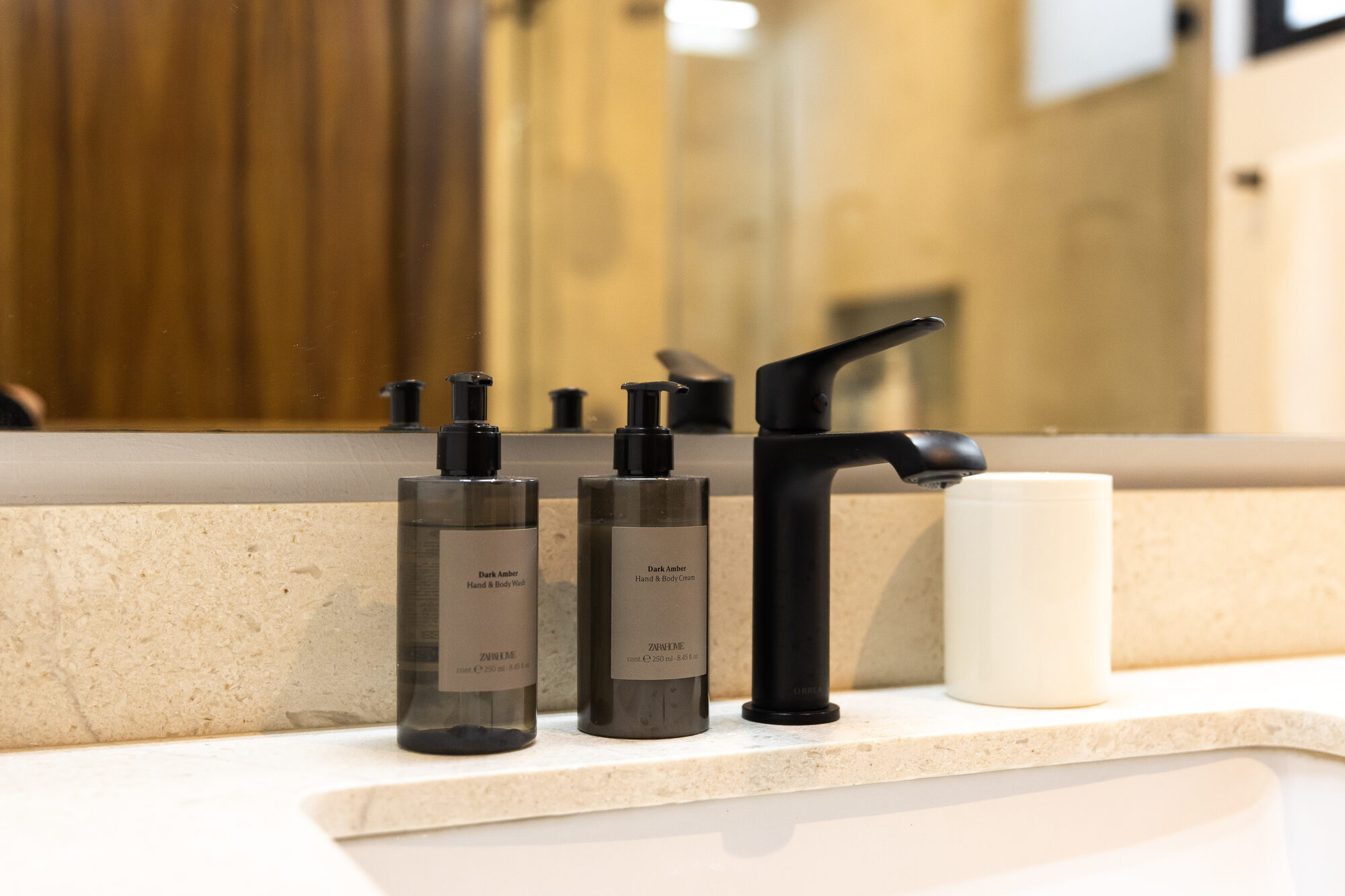 Toiletries and folded towels set out in the bathroom