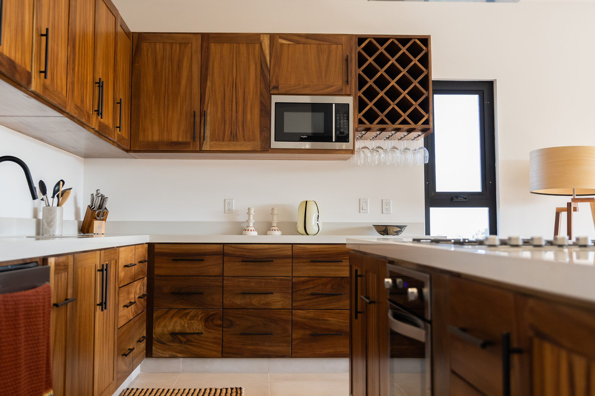 A built-in wine rack beside the kitchen cabinetry